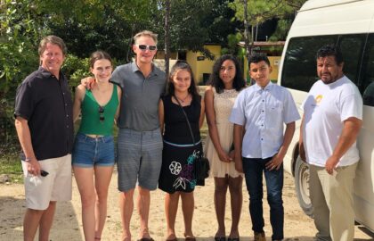 Group of people standing by a van